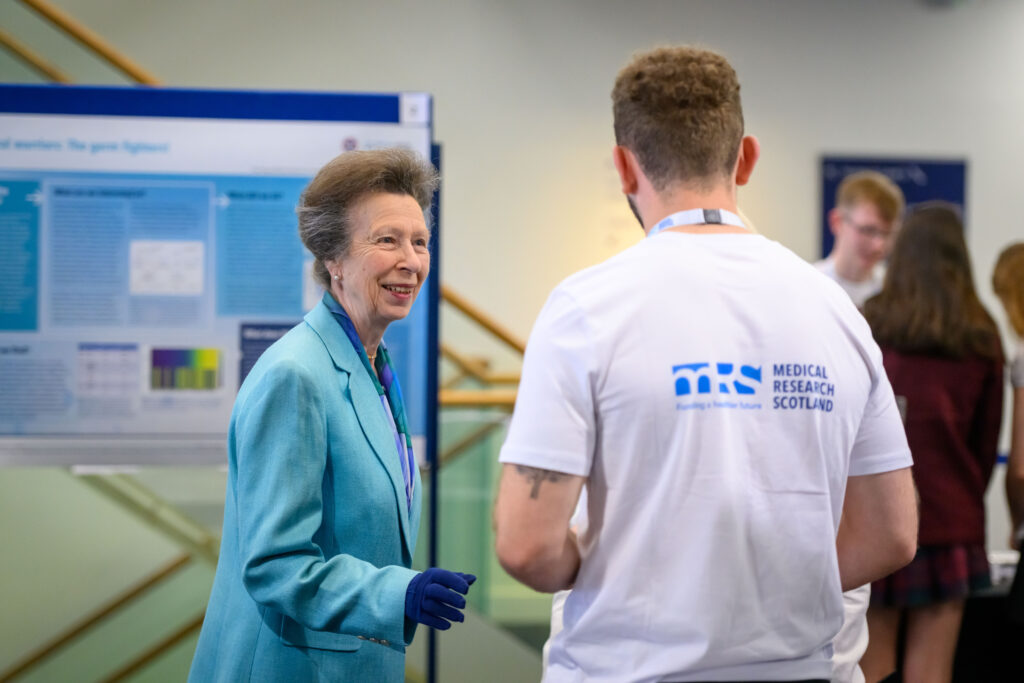 HRH The Princess Royal talking with a researcher