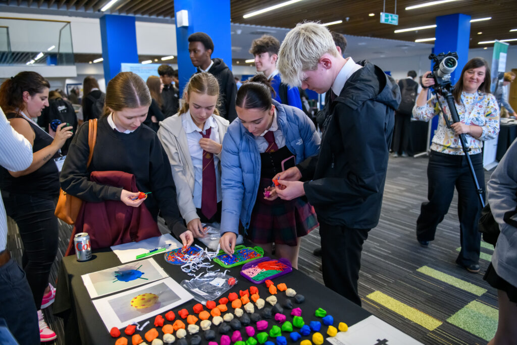 Pupils taking partin a hands on activity making viruses out of Play Dough and accessroies.