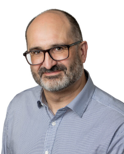 Portrait photo of Dr Alun Hughes