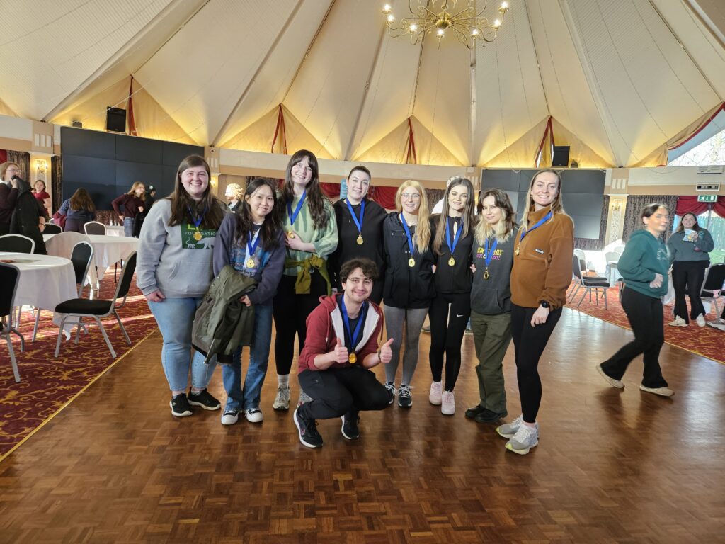The team of students who won the Scavenger Hunt wearing their medals